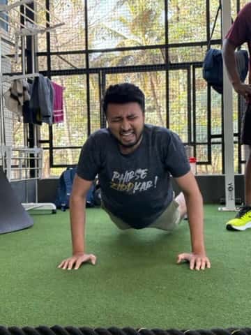 Member pushing through a set during a coached session at FOMO Training