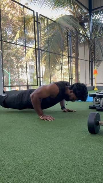 Member training push-ups on the outdoor turf at FOMO Training, Carmelaram