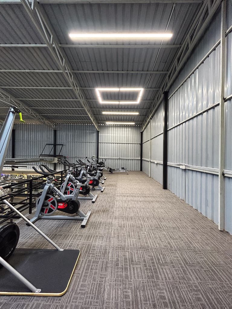 Indoor cycling studio with spin bikes at FOMO Training, Bengaluru